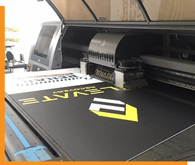 A printer with some type of yellow and black design on it