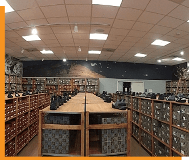 A room filled with lots of shelves and tables.