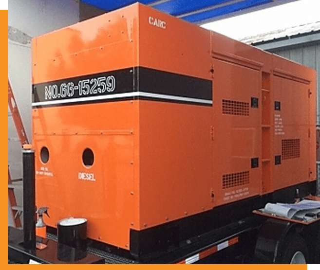 A large orange and black generator sitting on top of a table.